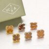 Van Cleef & Arpels Sweet Alhambra Earrings Yellow Gold With Tiger’s Eye Mother Of Pearl - Image 5