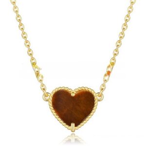Van Cleef Arpels Sweet Alhambra Heart Pendant Yellow Gold With Tiger’s Eye Mother Of Pearl