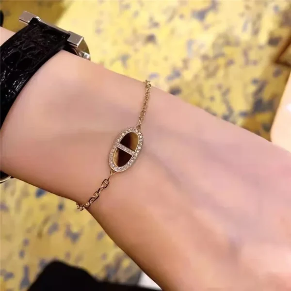 Hermes bracelet with half diamonds on one side and full diamonds on the other - Image 3