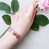 Hermes pink enameled bracelet with rose gold-tone border - Image 5